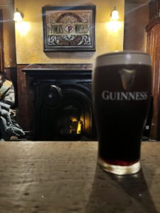 A pint by the fireplace